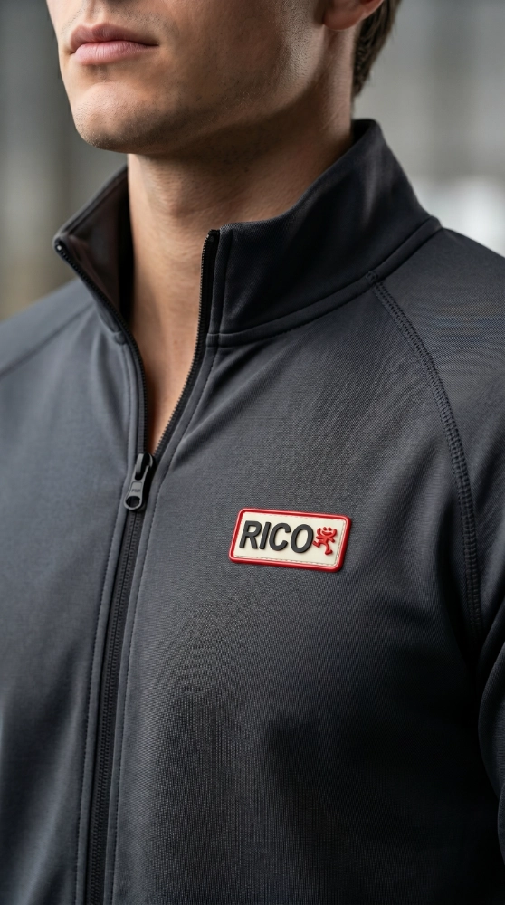 Man wearing a jacket with a custom silicone patch on the chest, showcasing personalized silicone patch for clothes.